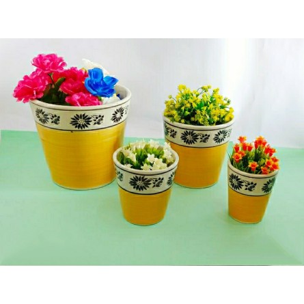 Set Of 4 Yellow And White Ceramic Pots